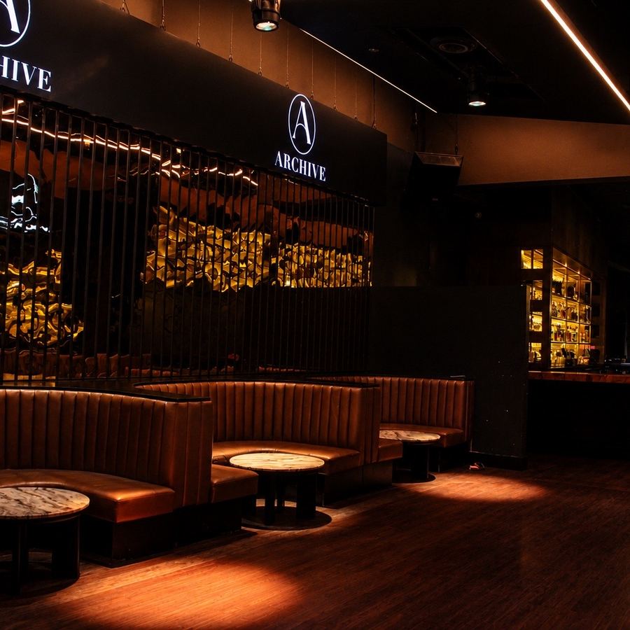 Entry area of Archive Sacramento with the illuminated Archive logo sign